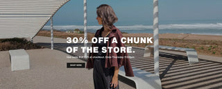 Woman standing on a beach with promotional text overlay