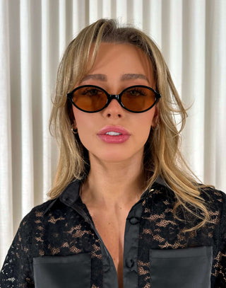 Black-oval-sunglasses-with-brown-category-2-lenses