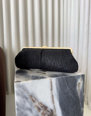 Black-straw-clutch-with-gold -lift-lock-and-chain-strap