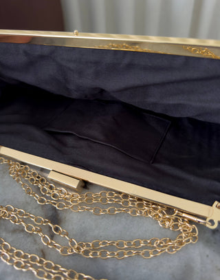 Black-straw-clutch-with-gold -lift-lock-and-chain-strap