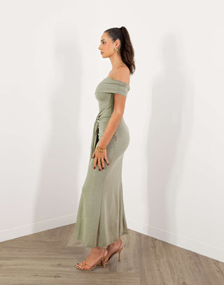 Model in green off shoulder fitted midi dress with gold buckle detail