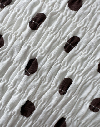 Brown and white polka dot fitted shirred sleeveless top