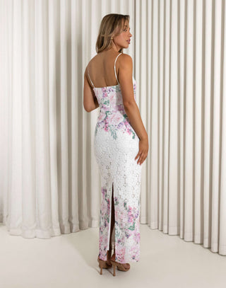 Woman wearing a floral dress with a white curtain background Aleyse floral lace maxi dress with back split