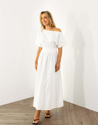 Model wearing white off shoulder midi dress with fitted waist