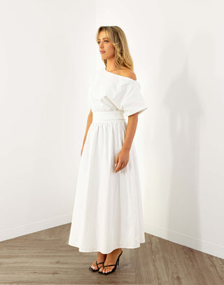 Model wearing white off shoulder midi dress with fitted waist