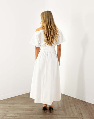 Model wearing white off shoulder midi dress with fitted waist