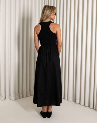 Black midi dress with shirred bodice and side split worn by model