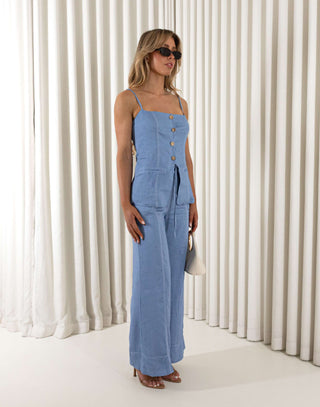 Blue tailored button up top with faux wooden buttons and adjustable straps