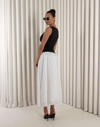 Black polka dot two-tone midi dress with fitted gathered bust