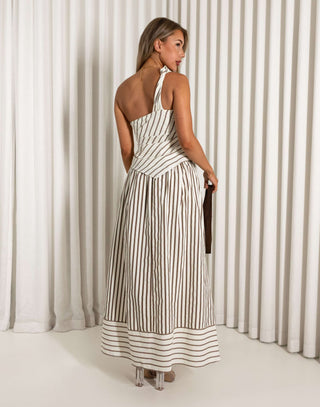 Woman wearing a brown striped set against a white curtain background
Cream and brown stripe matching top and maxi skirt set