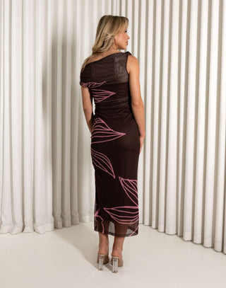 Woman wearing a black dress with pink floral patterns against a white curtain background Brown off shoulder mesh midi dress with floral print and side split