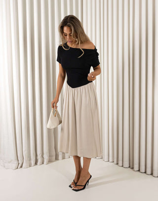 Two tone beige and black off shoulder midi dress with ribbed top and flowing skirt