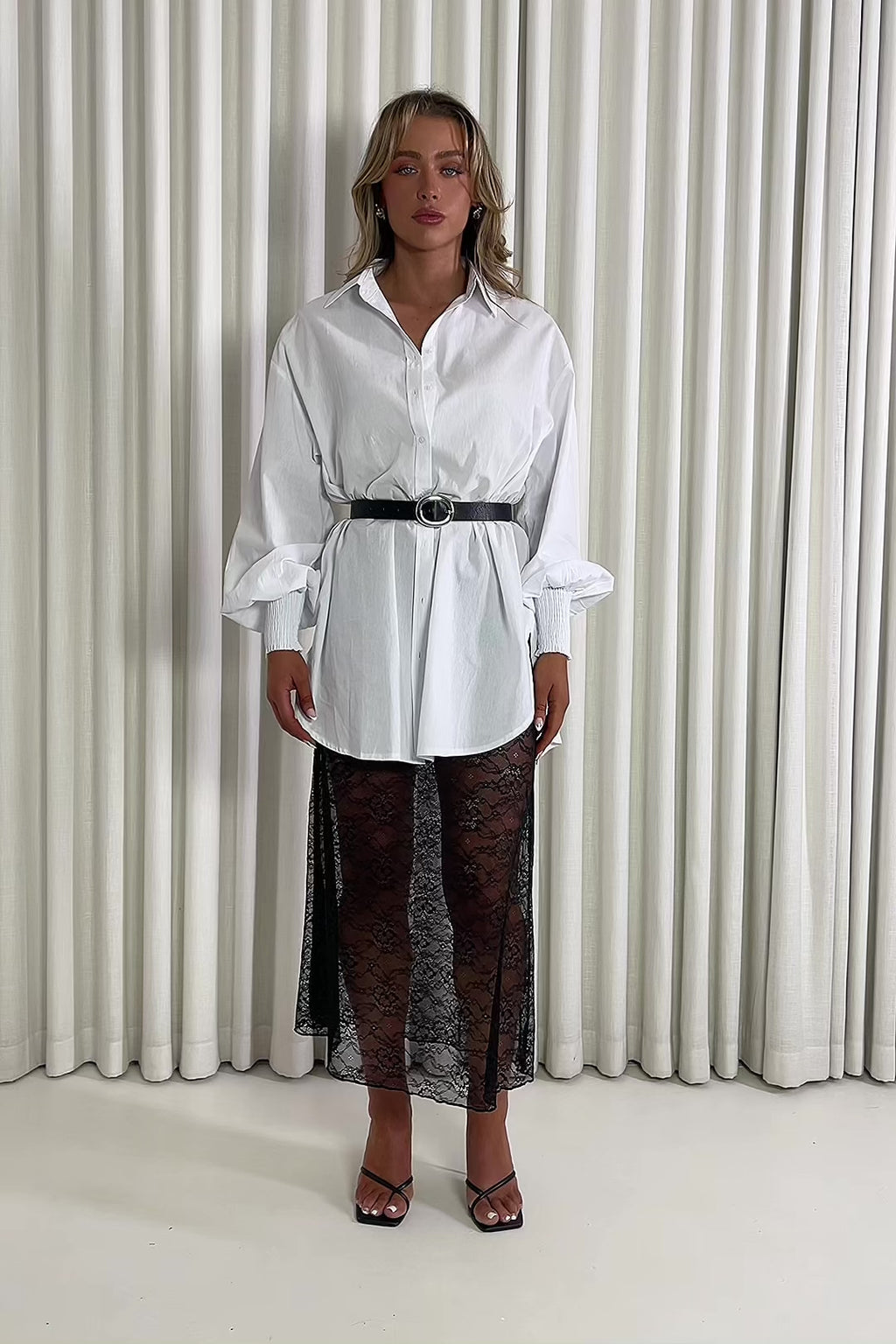 White oversized cotton tunic with collar, shirred cuffs and side slits & Black unlined lace A line midi skirt, high waisted and sheer