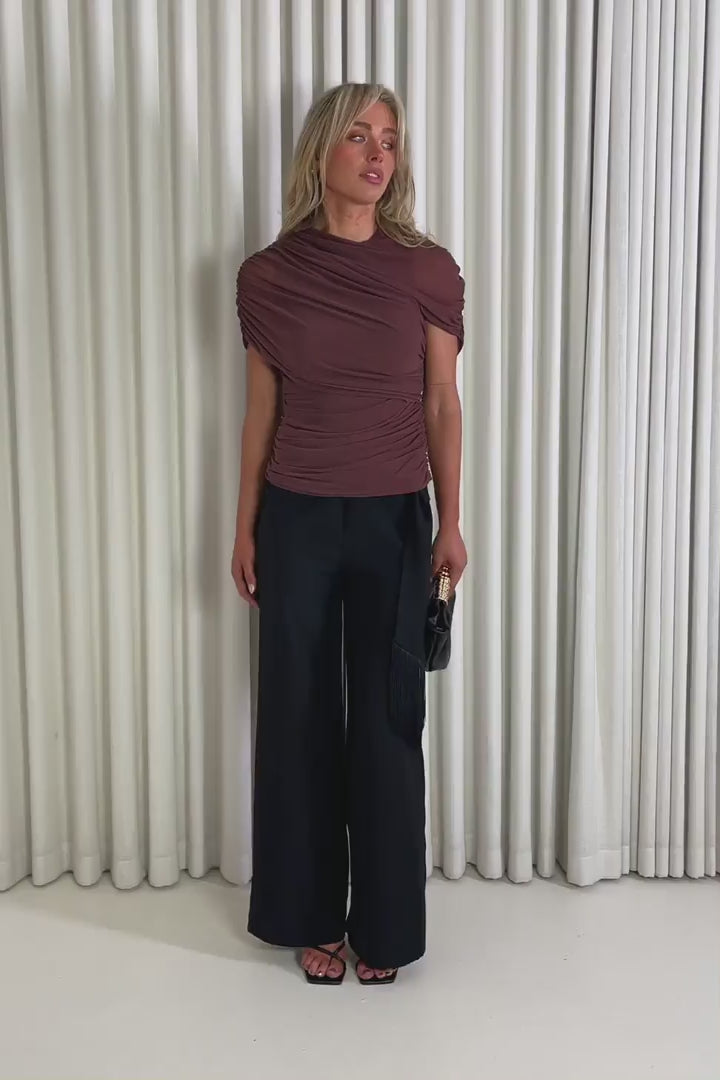 Model showing the brown drape Stanley top and Gabrielle Black Pants from the front, side and back to demonstrate its fit and movement.