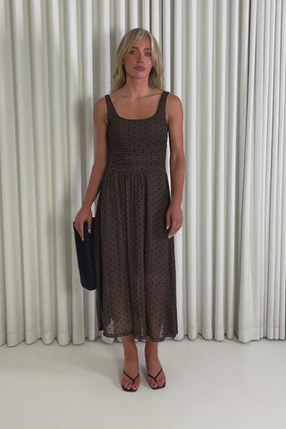 Model showing the brown polka dot  Bobby midi dress from the front, side and back to demonstrate its fit and movement.