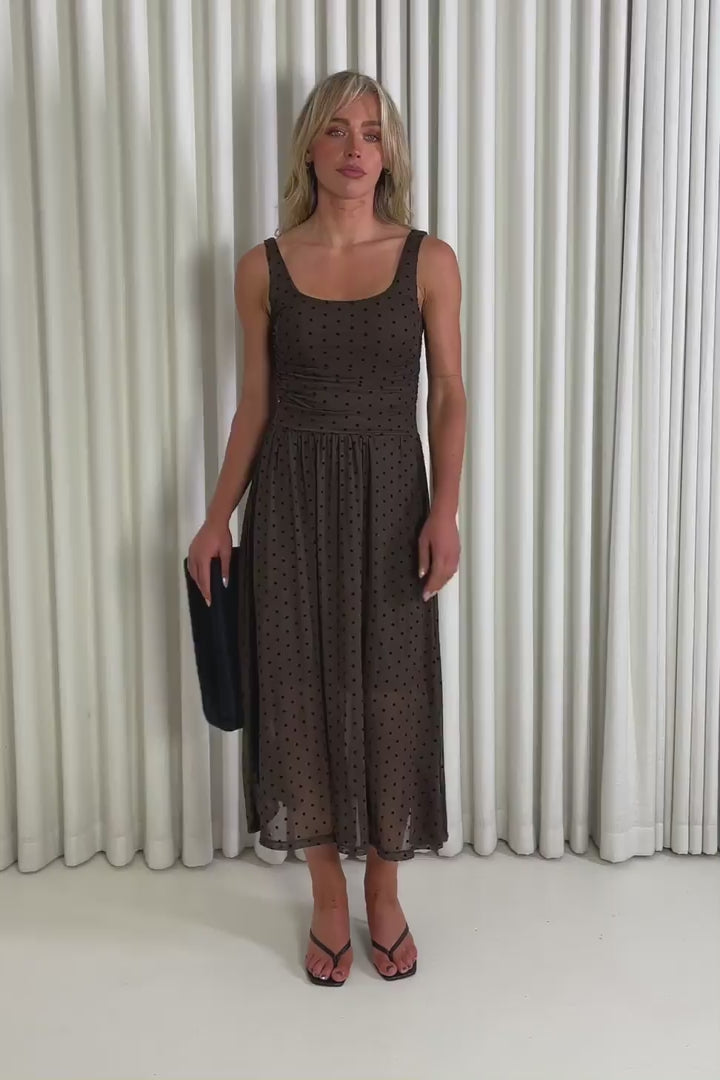 Model showing the brown polka dot  Bobby midi dress from the front, side and back to demonstrate its fit and movement.