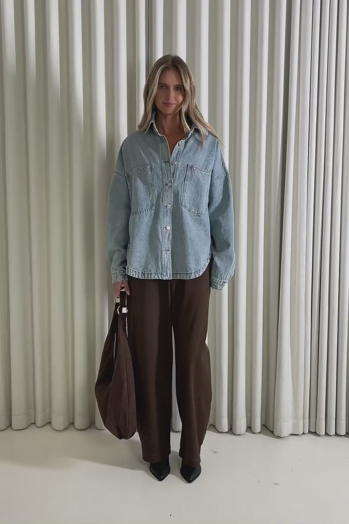 Model showing the Wes Denim Shacket from the front, side and back to demonstrate its fit and movement.