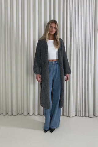 Model showing the Landry Longline Cardigan from the front, side and back to demonstrate its fit and movement.