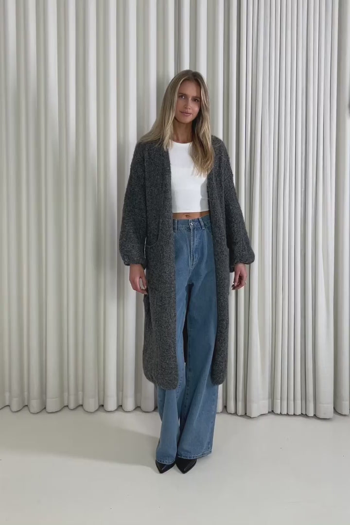 Model showing the Landry Longline Cardigan from the front, side and back to demonstrate its fit and movement.