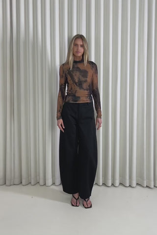 Model showing the Kohl Brown Top from the front, side and back to demonstrate its fit and movement.