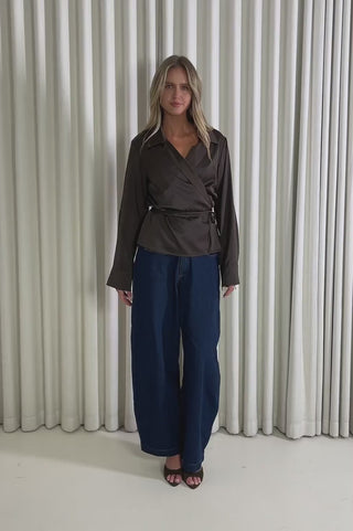 Model showing the Zoey Wrap Shirt from the front, side and back to demonstrate its fit and movement.