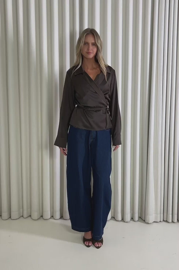 Model showing the Zoey Wrap Shirt from the front, side and back to demonstrate its fit and movement.