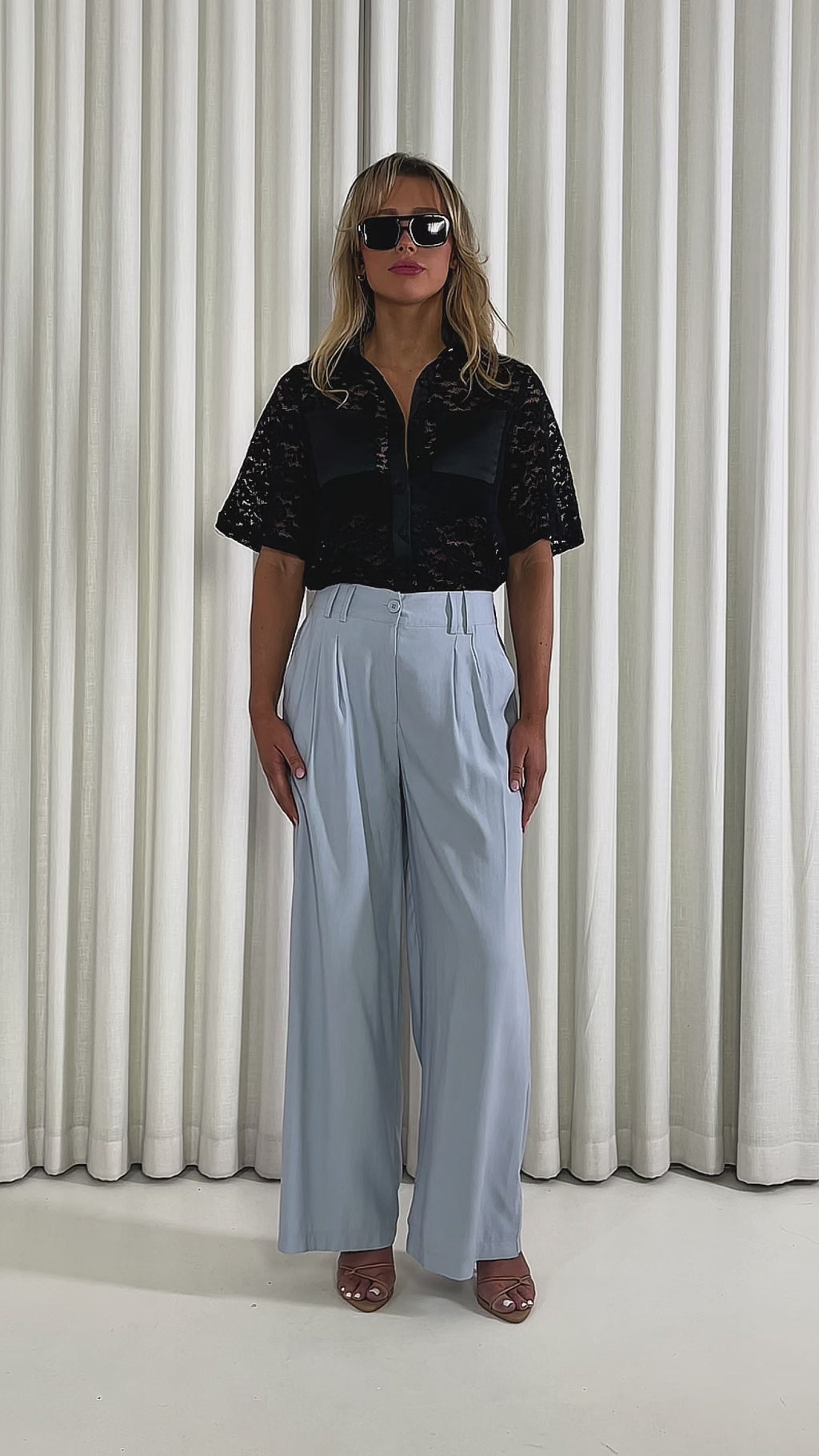 Black-relaxed-lace-shirt-with-collar-short-sleeves-and-button-front & Blue-wide-leg-high-waist-dress-pants-with-side-pockets