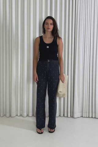 Model showing the Kennedy Stud Jeans from the front, side and back to demonstrate their fit and movement.