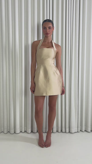 Champagne halter mini dress with structured A-line and pockets