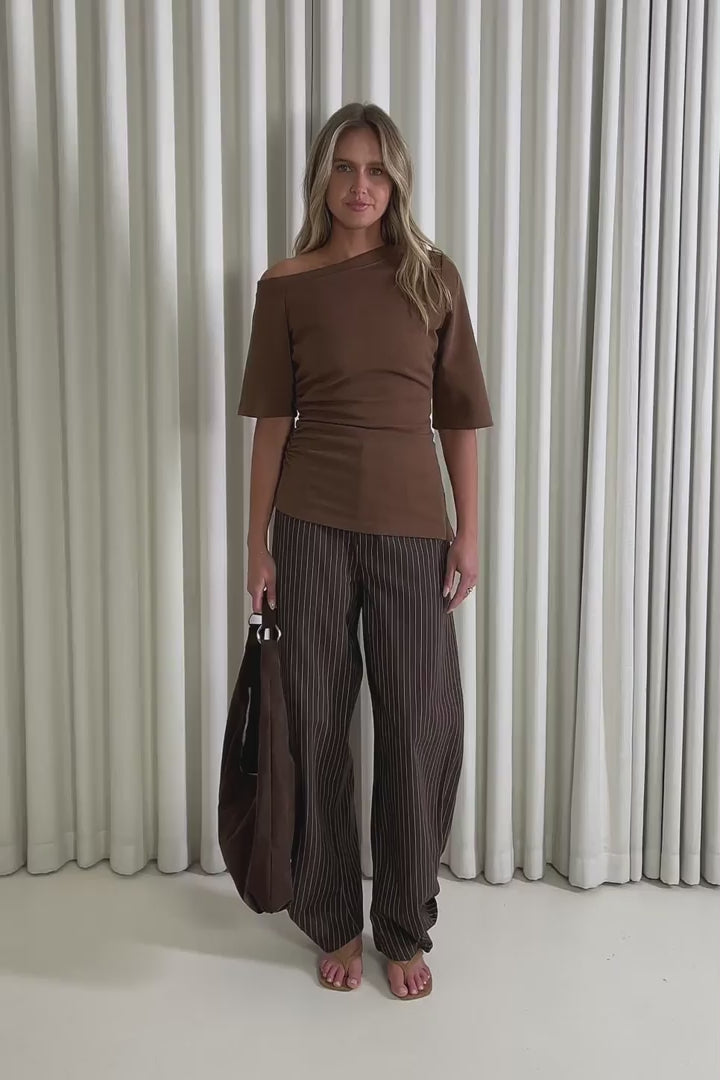Model showing the Tyler Off Shoulder Top from the front, side and back to demonstrate its fit and movement.