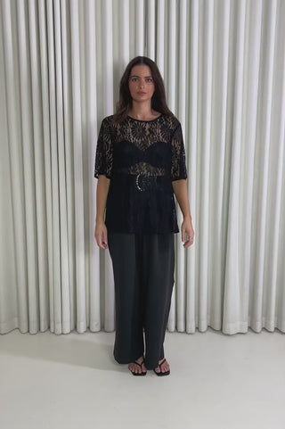 Model showing the Zillah Black Lace Top from the front, side and back to demonstrate its fit and movement.