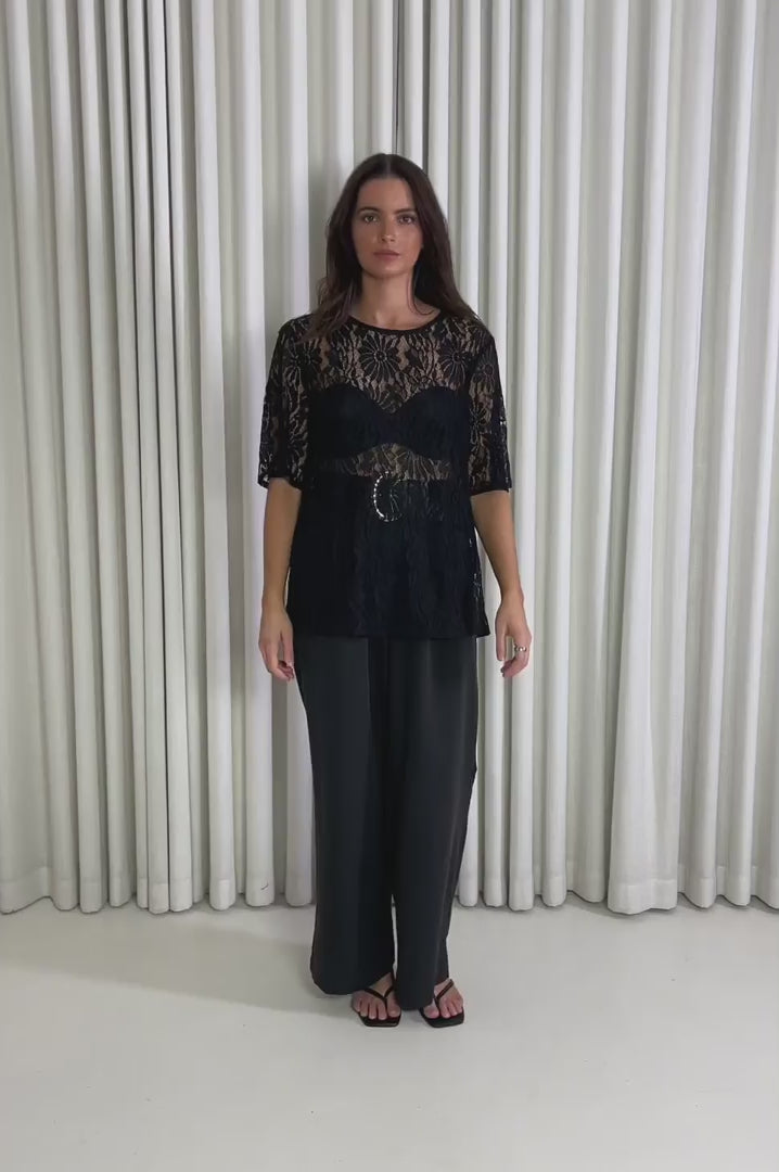 Model showing the Zillah Black Lace Top from the front, side and back to demonstrate its fit and movement.