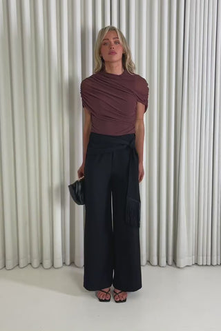 Model showing the Gabrielle Black Pants and drape Stanley top from the front, side and back to demonstrate its fit and movement.