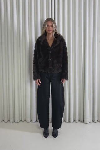 Model showing the Miranda Faux Fur Jacket from the front, side and back to demonstrate its fit and movement.