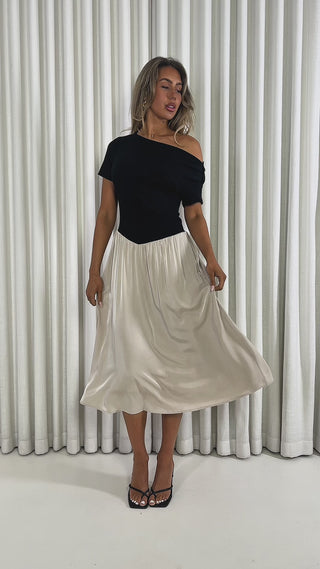 Two tone beige and black off shoulder midi dress with ribbed top and flowing skirt