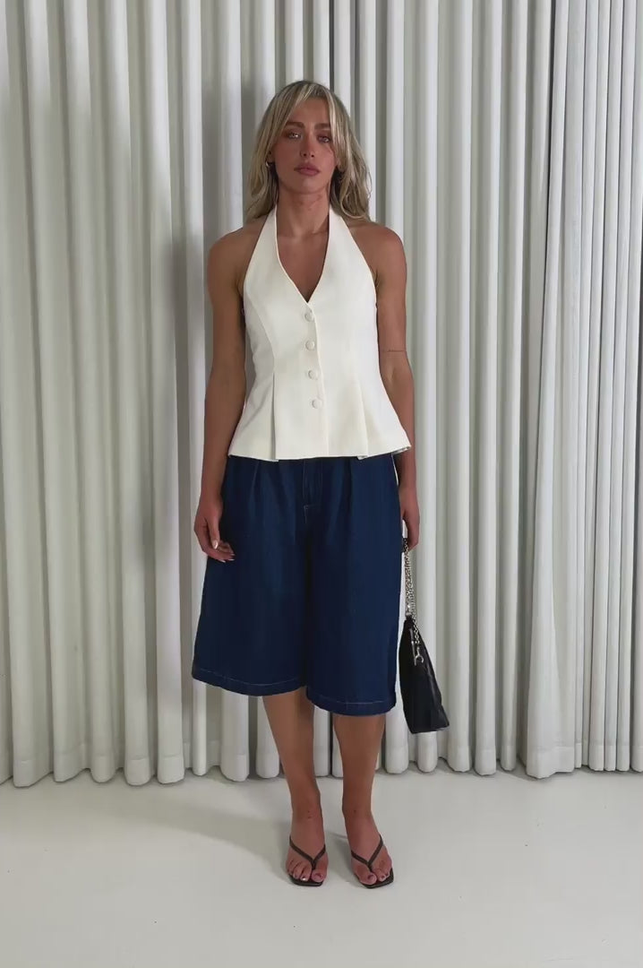 Model showing the cream Sabrina Halter Top and Jack Denim Shorts
 from the front, side and back to demonstrate its fit and movement.