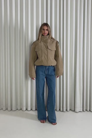 Model showing the Logan Bomber Jacket from the front, side and back to demonstrate its fit and movement.