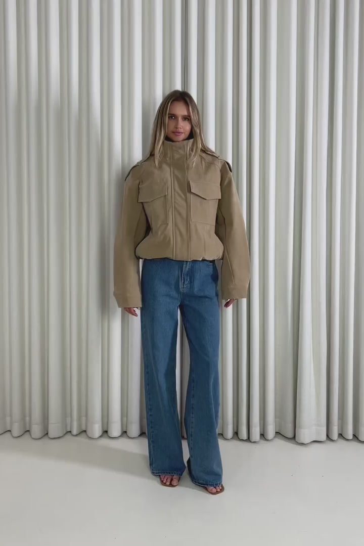 Model showing the Logan Bomber Jacket from the front, side and back to demonstrate its fit and movement.