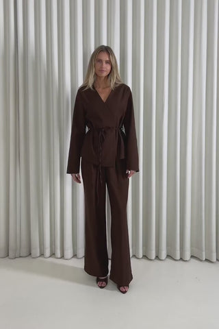 Model showing the Tucker Tie Blazer and matching High Waist Pants from the front, side and back to demonstrate their fit and movement.