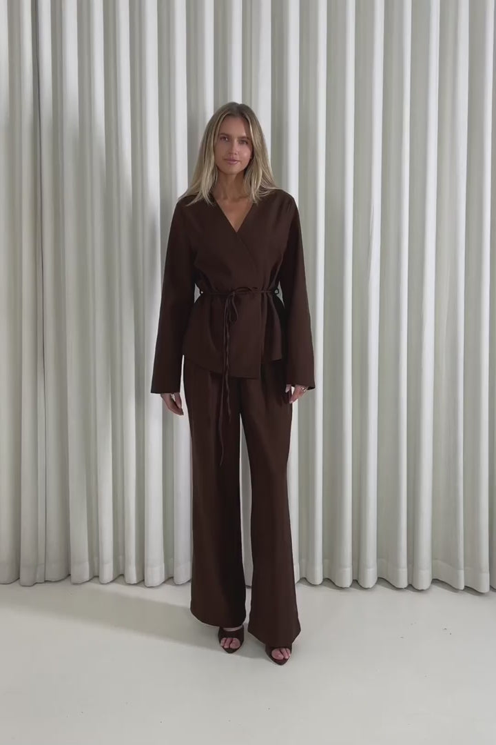 Model showing the Tucker Tie Blazer and matching High Waist Pants from the front, side and back to demonstrate their fit and movement.