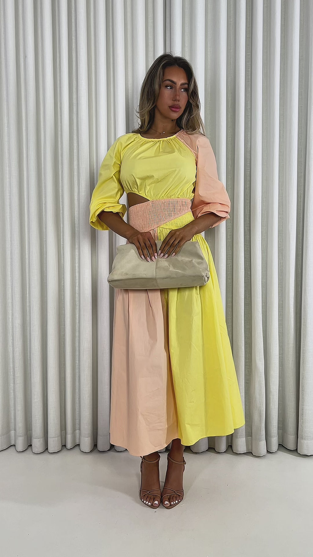 Yellow cotton midi dress with round neck, shirred waist and side cut outs