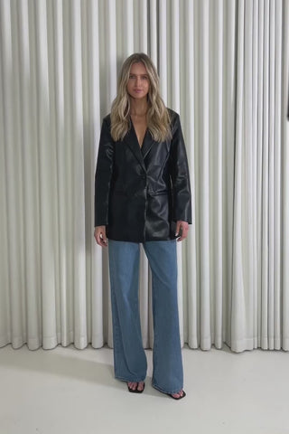 Model showing the Graham Black Blazer from the front, side and back to demonstrate its fit and movement.