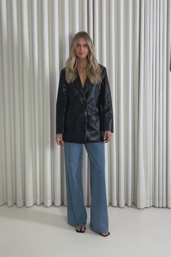 Model showing the Graham Black Blazer from the front, side and back to demonstrate its fit and movement.