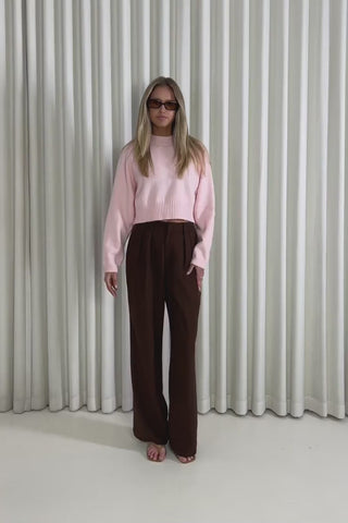 Model showing the Delaney Pink Cropped Knit from the front, side and back to demonstrate its fit and movement.