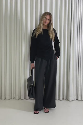 Model showing the Clayton Back Asymmetrical Top from the front, side and back to demonstrate its fit and movement.