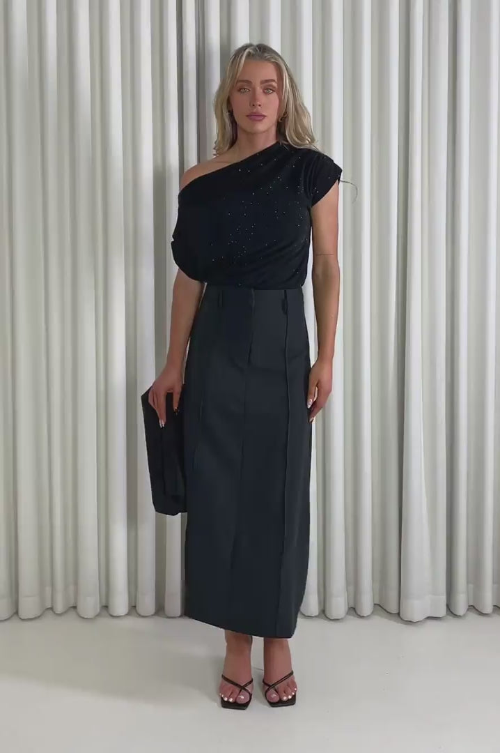Model showing the black Amanda top and Theresa skirt from the front, side and back to demonstrate its fit and movement.