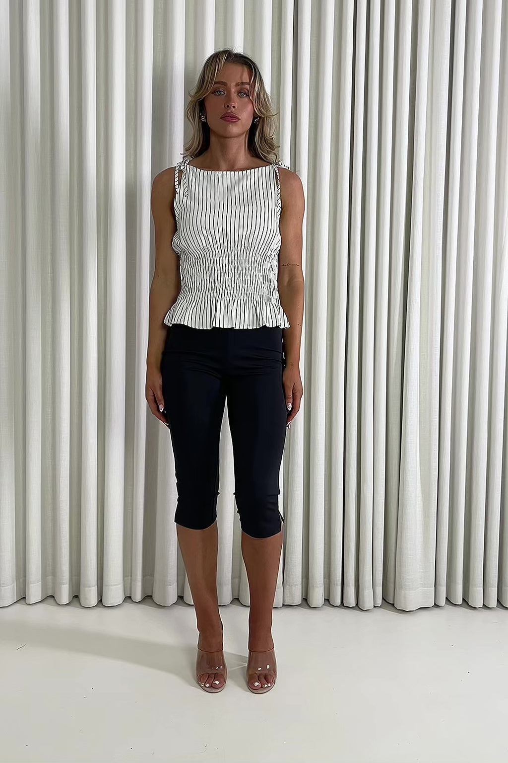 Striped top with shirred waist and adjustable tie straps