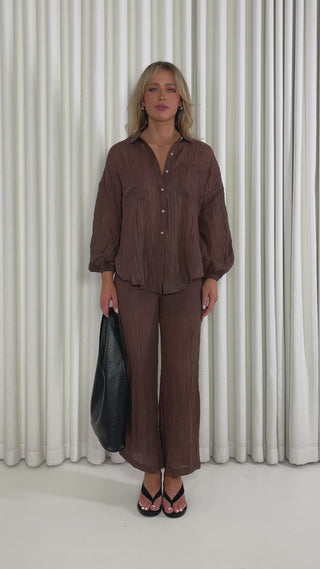 Brown oversized cotton-blend button up shirt with balloon sleeves & Brown relaxed high-waist cotton-blend pants with drawstring and pockets