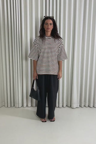 Model showing the Jacob Stripe T-Shirt from the front, side and back to demonstrate its fit and movement.