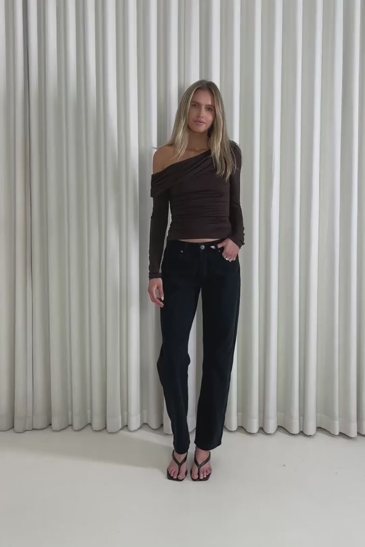 Model showing the Dean Black Jeans from the front, side and back to demonstrate their fit and movement.
